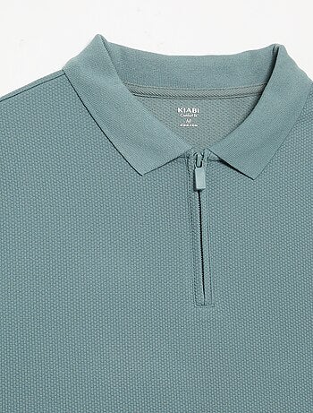 Polo van gewafelde stof met ritskraag