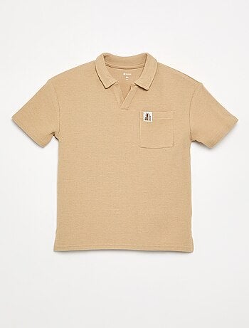Polo van gewafelde stof