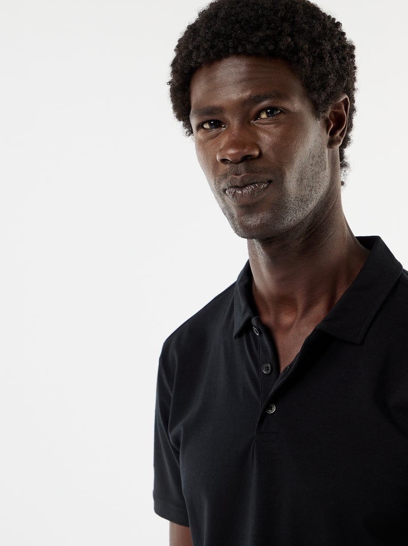 Polo van jerseytricot met knoopsluiting Zwart - Kiabi