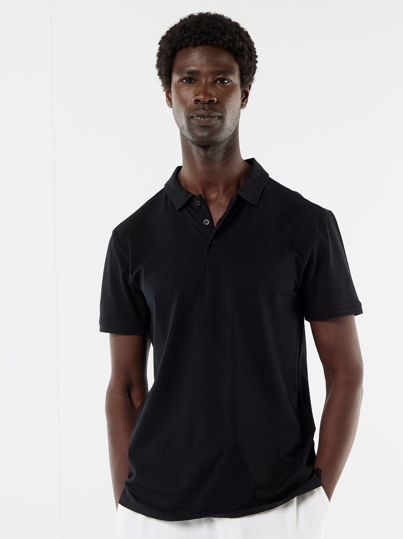 Polo van jerseytricot met knoopsluiting Zwart - Kiabi