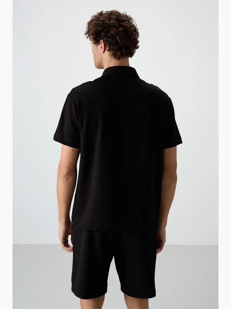 Poloshirt ruimvallend tommy Zwart - Kiabi