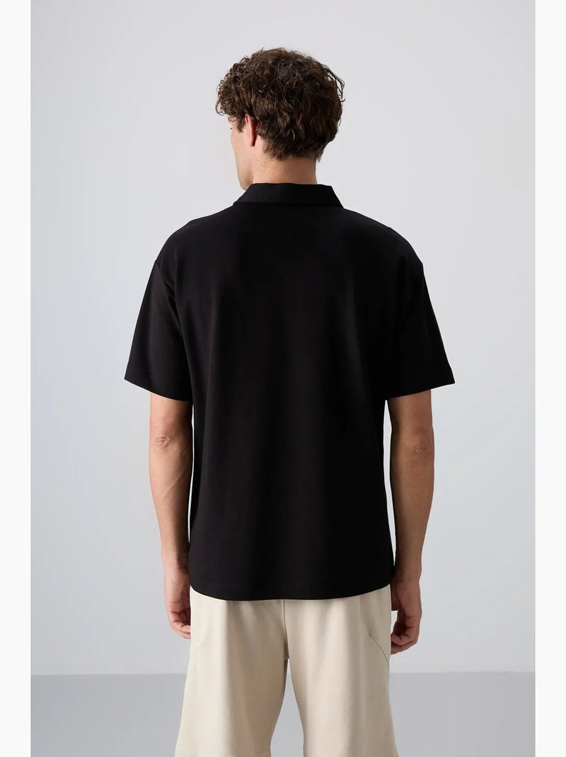 Poloshirt ruimvallend tommy Zwart - Kiabi