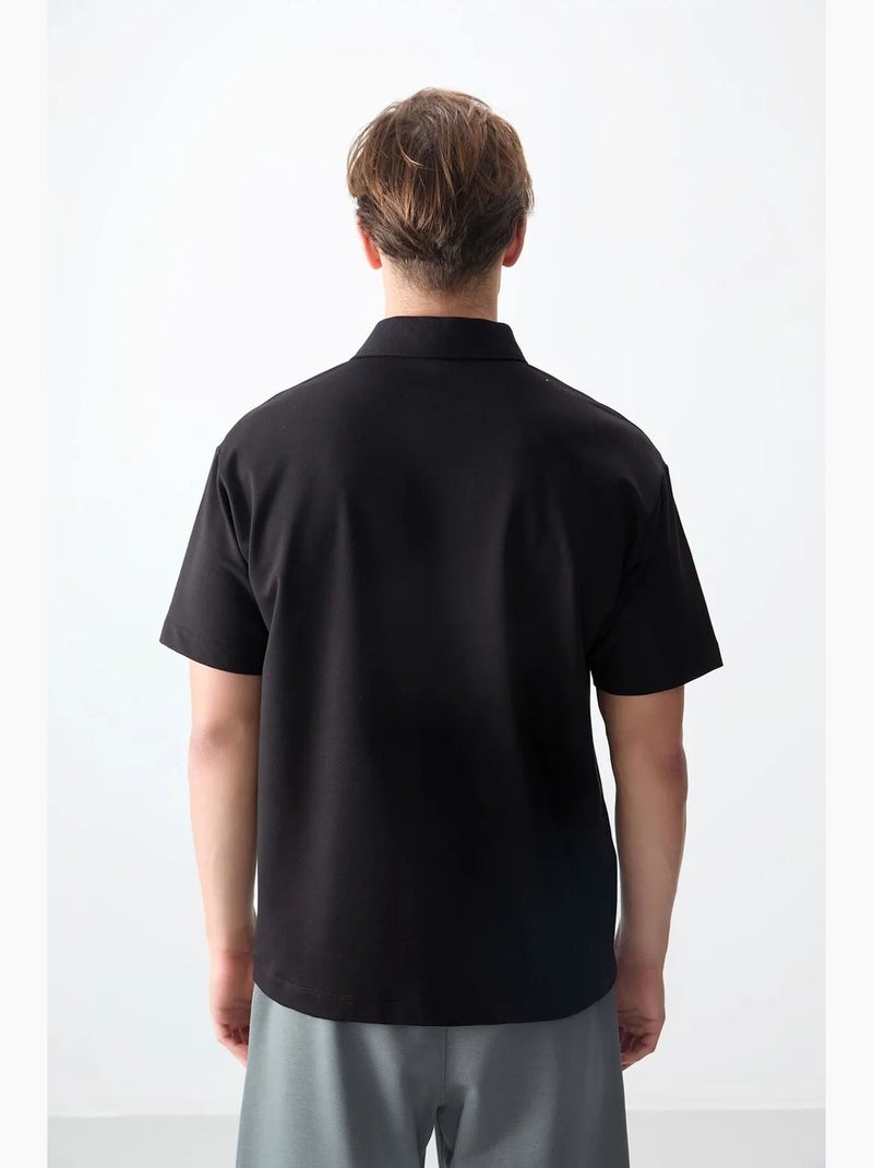 Poloshirt ruimvallend tommy Zwart - Kiabi