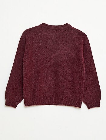 Pull en maille avec nœud en maille torsade devant