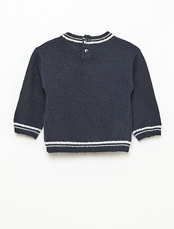 Pull uni avec bords contrastés