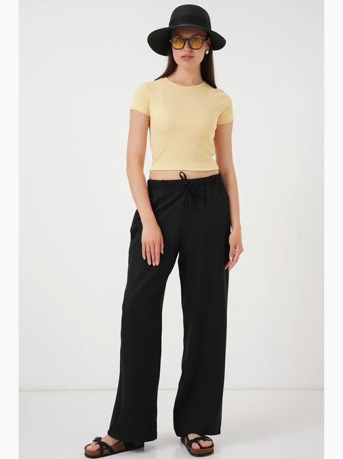 Relaxed broek met wijde pijpen en trekkoord bdart - Kiabi Relaxed broek met wijde pijpen en trekkoord bdart - Kiabi