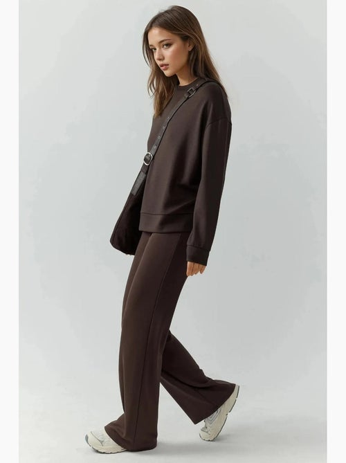 Relaxed fit sweatpants met rechte pijpen met modal-touch hiccup - Kiabi Relaxed fit sweatpants met rechte pijpen met modal-touch hiccup - Kiabi