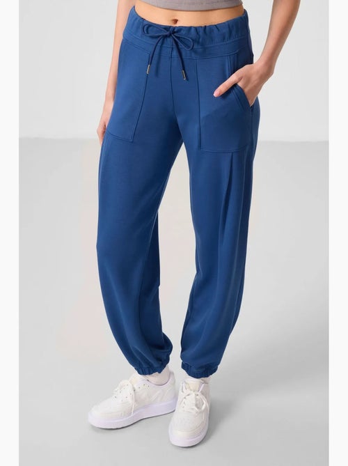Relaxte broek van crêpe met middelhoge taille en zak tommy - Kiabi Relaxte broek van crêpe met middelhoge taille en zak tommy - Kiabi
