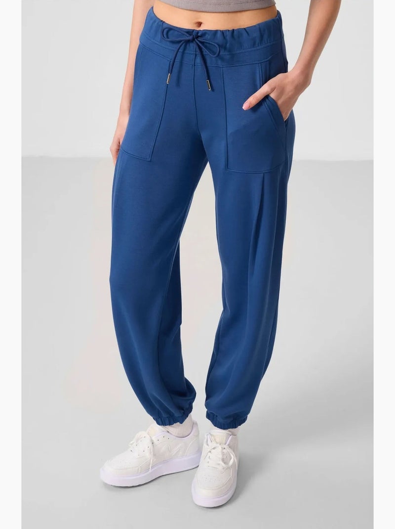 Relaxte broek van crêpe met middelhoge taille en zak tommy Blauw - Kiabi