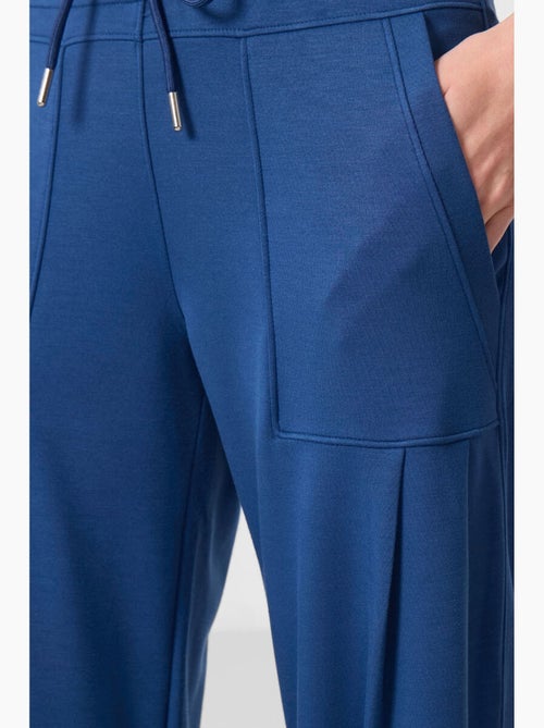 Relaxte broek van crêpe met middelhoge taille en zak tommy - Kiabi Relaxte broek van crêpe met middelhoge taille en zak tommy - Kiabi