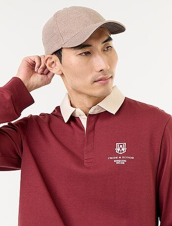 Rugbypolo met geborduurde opschriften
