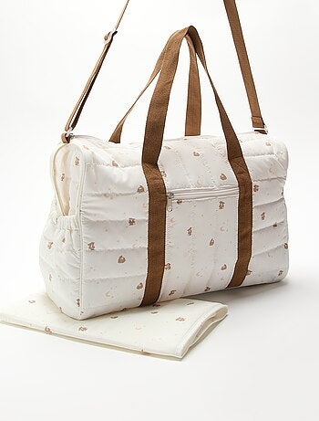 Sac à langer avec tapis à langer à l'intérieur et attache poussette.