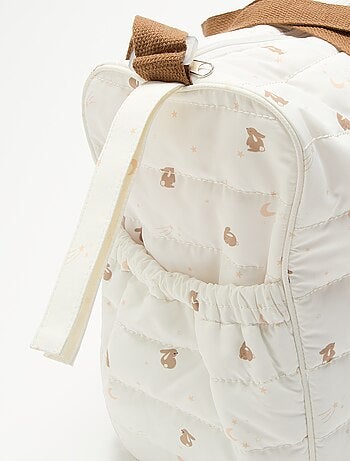 Sac à langer avec tapis à langer à l'intérieur et attache poussette.