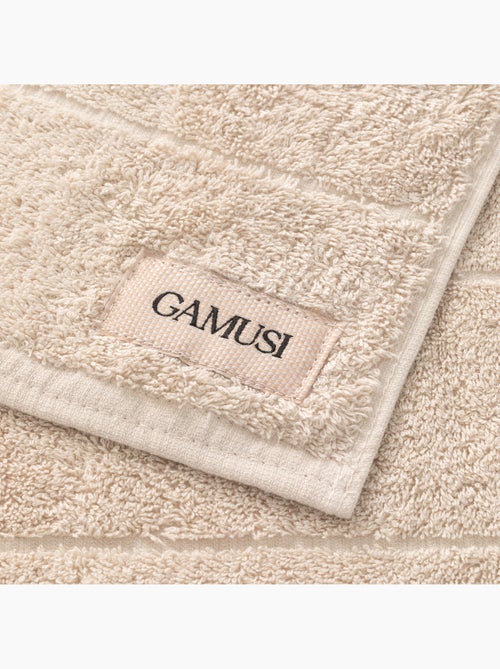 Set douche- en wastafelhanddoeken 100% katoen, 600 g/m², met ophanglus - Gamusi - Kiabi Set douche- en wastafelhanddoeken 100% katoen, 600 g/m², met ophanglus - Gamusi - Kiabi