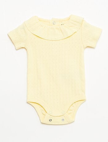 Set rekbare meegroei-body + pyjama van ribtricot
