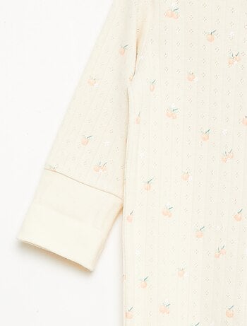 Set rekbare meegroei-body + pyjama van ribtricot