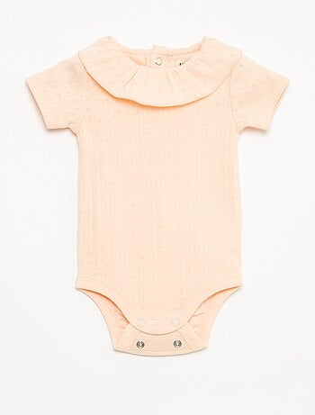 Set rekbare meegroei-body + pyjama van ribtricot