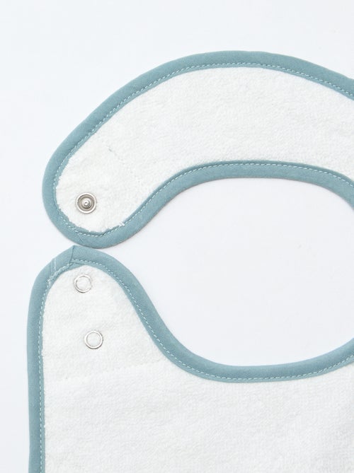 Setje met 2 slabbetjes van luchtig katoen en voering van badstof - Kiabi Setje met 2 slabbetjes van luchtig katoen en voering van badstof - Kiabi