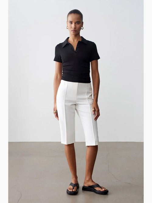Short capri droit taille haute avec fente dilvin - Kiabi Short capri droit taille haute avec fente dilvin - Kiabi