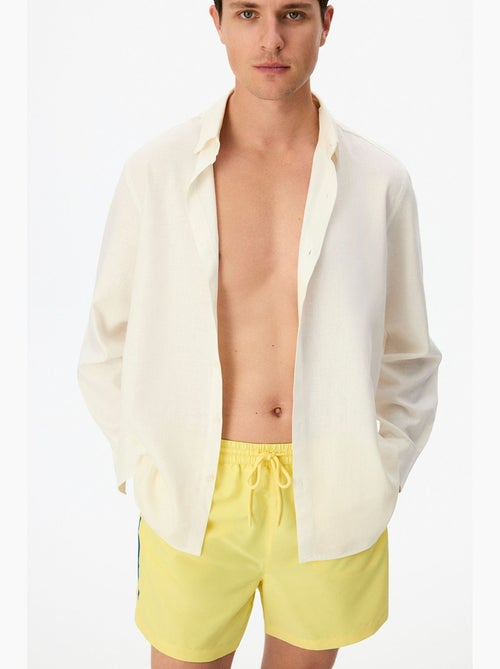 Short de bain homme opposite line penti - Kiabi Short de bain homme opposite line penti - Kiabi
