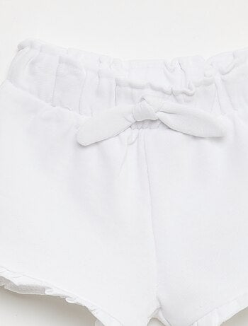 Short volanté avec nœud à la taille