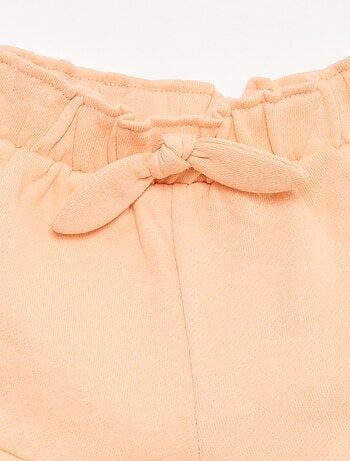 Short volanté avec nœud à la taille