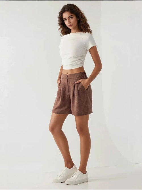 Shorts met hoge taille, plooien, lyocell en soft touch hiccup - Kiabi Shorts met hoge taille, plooien, lyocell en soft touch hiccup - Kiabi