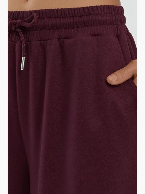 Soft modal touch sweatpants met wijde pijpen hiccup - Kiabi Soft modal touch sweatpants met wijde pijpen hiccup - Kiabi