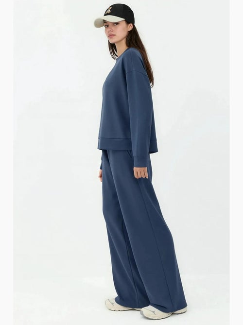 Soft modal touch sweatpants met wijde pijpen hiccup - Kiabi Soft modal touch sweatpants met wijde pijpen hiccup - Kiabi