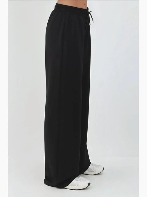Soft modal touch sweatpants met wijde pijpen hiccup - Kiabi Soft modal touch sweatpants met wijde pijpen hiccup - Kiabi