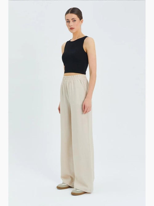 Soft touch high-waist broek met wijde pijpen mixray - Kiabi Soft touch high-waist broek met wijde pijpen mixray - Kiabi