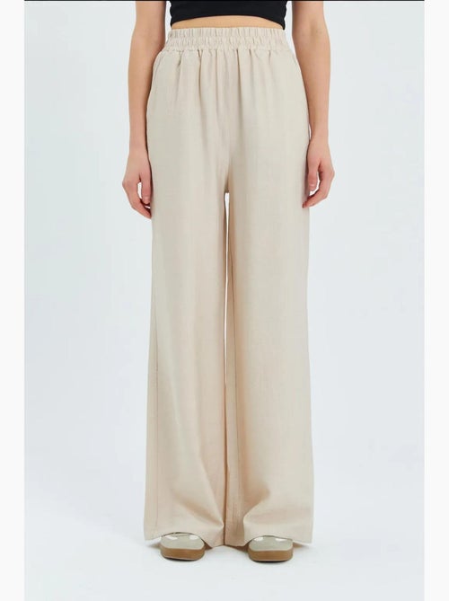 Soft touch high-waist broek met wijde pijpen mixray - Kiabi Soft touch high-waist broek met wijde pijpen mixray - Kiabi
