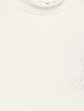 Sous-pull uni avec finitions ondulées