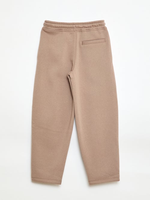 Sporttraining in ruimvallende joggingstof - Kiabi