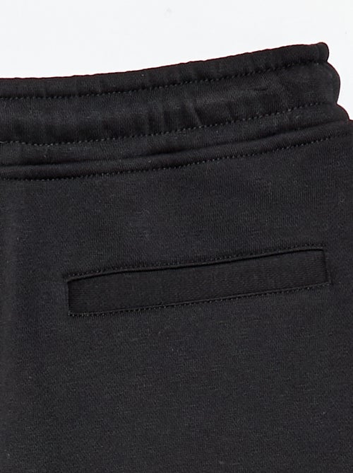 Sporttraining in ruimvallende joggingstof - Kiabi