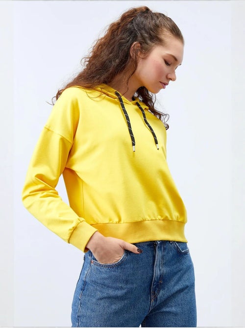 Sweat à capuche coupe décontractée avec lien tommy - Kiabi Sweat à capuche coupe décontractée avec lien tommy - Kiabi