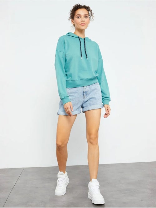 Sweat à capuche coupe décontractée avec lien tommy - Kiabi Sweat à capuche coupe décontractée avec lien tommy - Kiabi