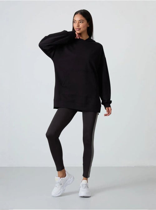 Sweat à capuche oversize imprimé avec poche tommy - Kiabi Sweat à capuche oversize imprimé avec poche tommy - Kiabi