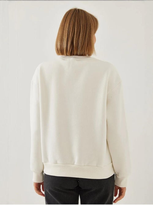 Sweat-shirt ras du cou en fil brossé imprimé cœur lucci - Kiabi Sweat-shirt ras du cou en fil brossé imprimé cœur lucci - Kiabi