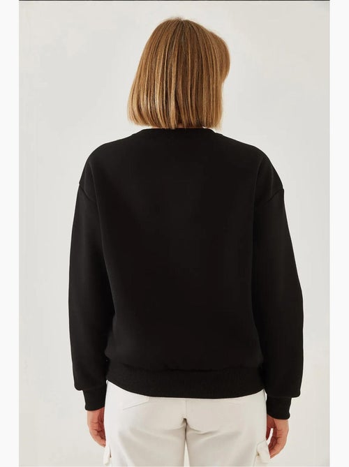 Sweat-shirt ras du cou en fil brossé imprimé cœur lucci - Kiabi Sweat-shirt ras du cou en fil brossé imprimé cœur lucci - Kiabi