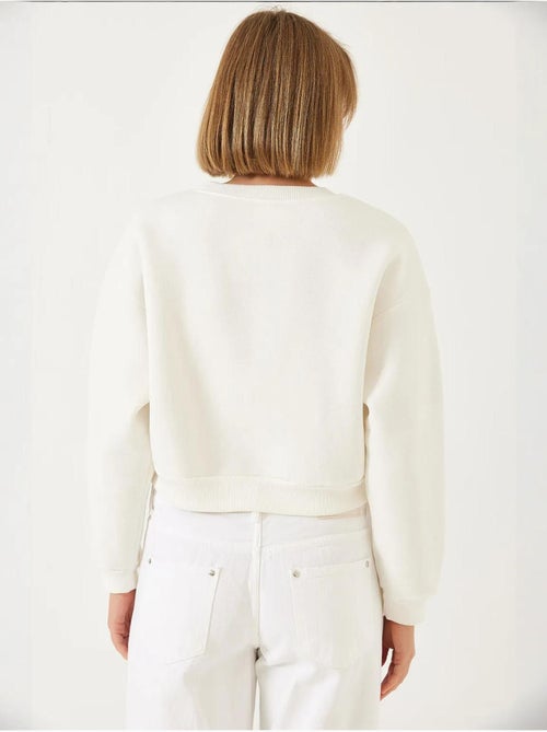 Sweat-shirt ras du cou en tissu brossé triple fil orné de perles lucci - Kiabi Sweat-shirt ras du cou en tissu brossé triple fil orné de perles lucci - Kiabi