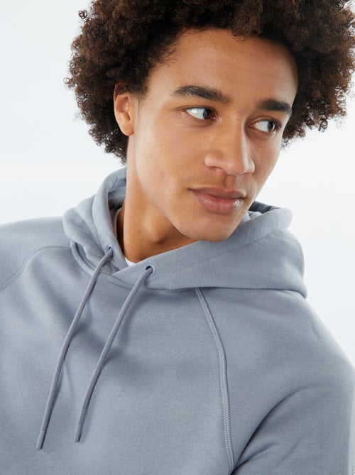 Sweat uni à capuche avec poches zippées - Kiabi