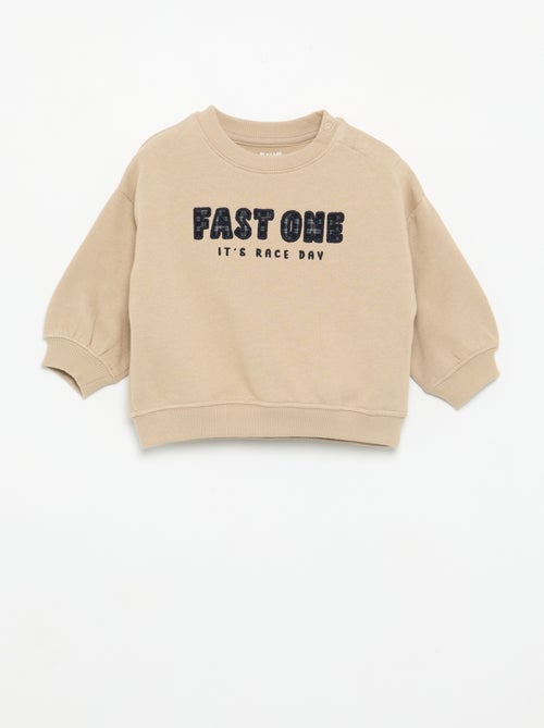 Sweat uni avec imprimé poitrine - Kiabi Sweat uni avec imprimé poitrine - Kiabi