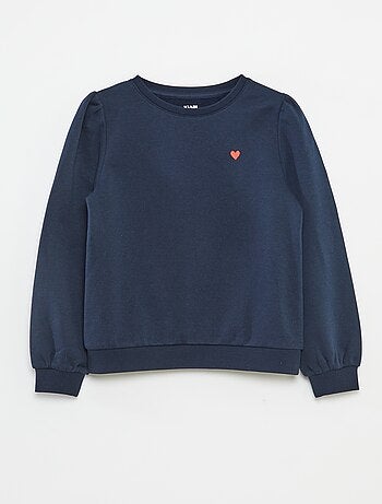 Sweater van joggingstof met borduursel en fronsjes op de schouder