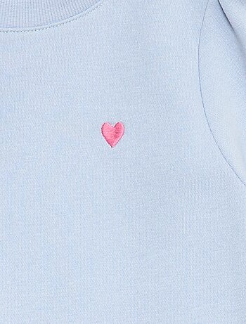 Sweater van joggingstof met borduursel en fronsjes op de schouder