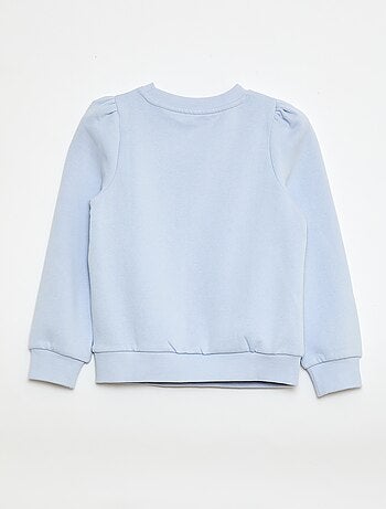 Sweater van joggingstof met borduursel en fronsjes op de schouder