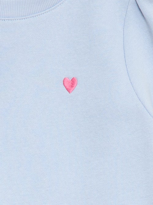 Sweater van joggingstof met borduursel en fronsjes op de schouder - Kiabi