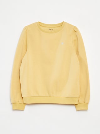 Sweater van joggingstof met borduursel en fronsjes op de schouder