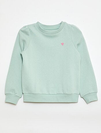 Sweater van joggingstof met borduursel en fronsjes op de schouder