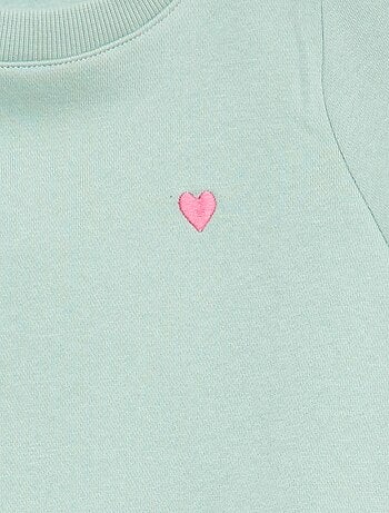 Sweater van joggingstof met borduursel en fronsjes op de schouder